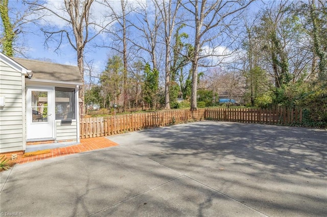 view of patio featuring fence