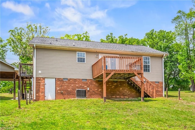back of property featuring a deck, stairway, and a yard