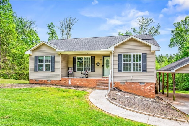 single story home featuring a porch, a front yard, crawl space, a carport, and roof with shingles