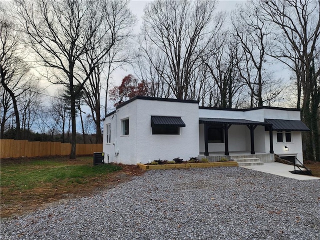 view of front of house featuring cooling unit