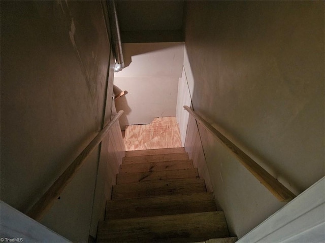 staircase featuring hardwood / wood-style flooring