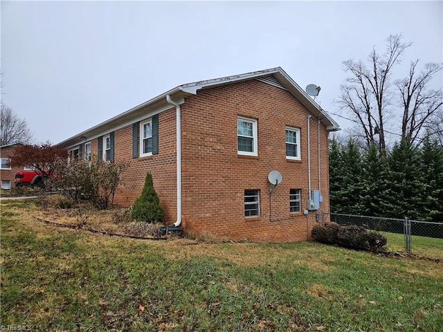 view of home's exterior featuring a yard