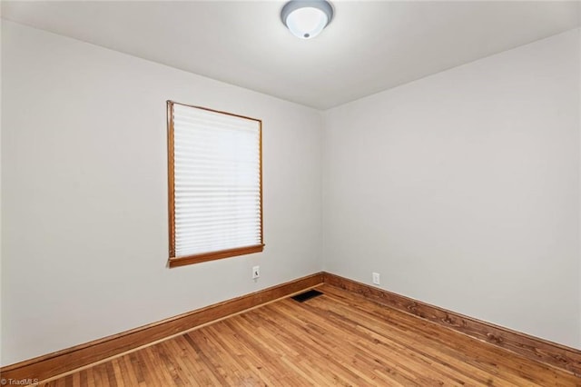 506 W 26th St, Winston-Salem, NC 27105 - empty room with baseboards and light wood-style flooring