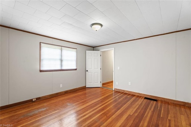 506 W 26th St, Winston-Salem, NC 27105 - empty room featuring ornamental molding and wood-type flooring