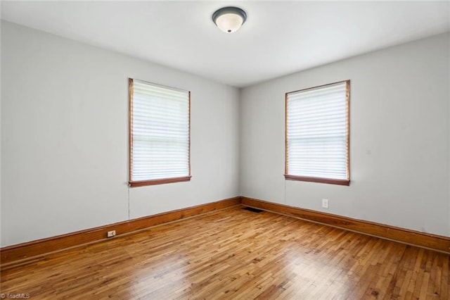 506 W 26th St, Winston-Salem, NC 27105 - spare room with plenty of natural light and hardwood / wood-style floors