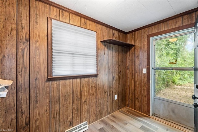 506 W 26th St, Winston-Salem, NC 27105 - unfurnished room featuring wooden walls, wood finished floors, and ornamental molding
