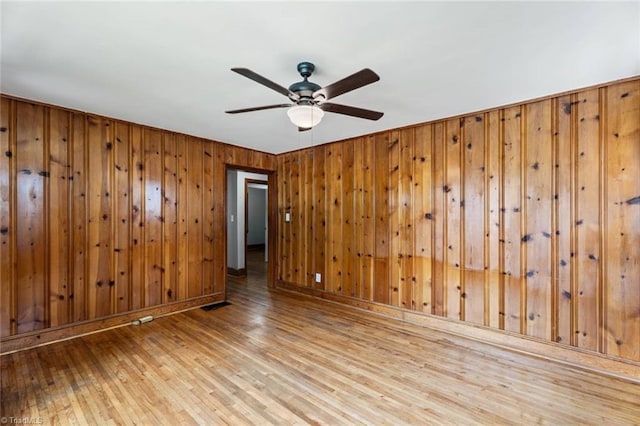 506 W 26th St, Winston-Salem, NC 27105 - empty room with wood-type flooring, ceiling fan, and wood walls