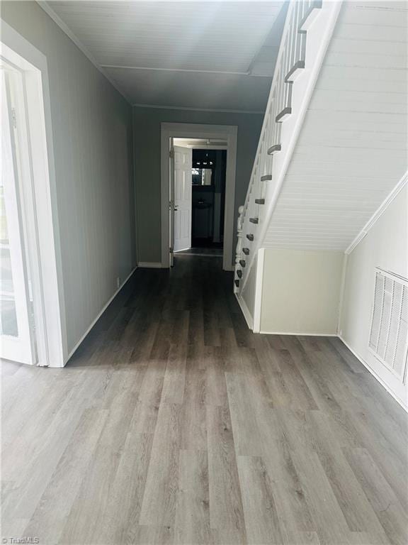 corridor with wood-type flooring