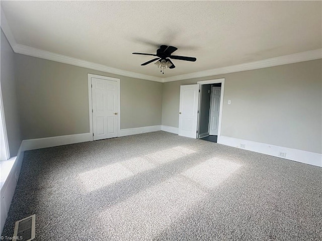 carpeted empty room with ornamental molding and ceiling fan