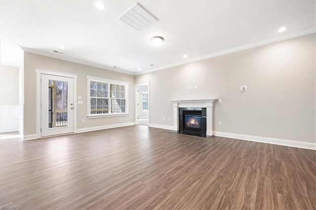 1811 Parham Dr Unit 89, Graham, NC 27253 - unfurnished living room featuring a fireplace with flush hearth, wood finished floors, recessed lighting, crown molding, and baseboards