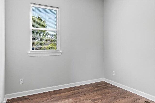 348 E Sprague St, Winston-Salem, NC 27127 - spare room featuring healthy amount of natural light and dark wood-style flooring