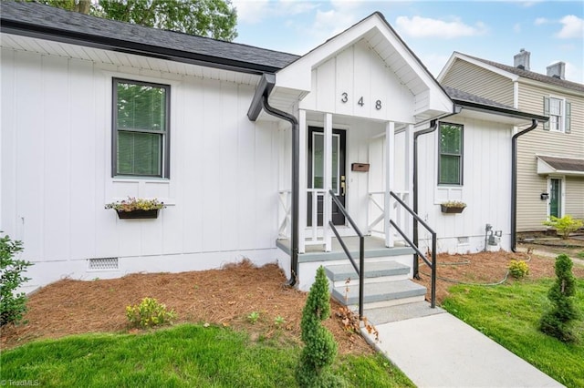 348 E Sprague St, Winston-Salem, NC 27127 - view of front of home featuring crawl space, board and batten siding, and roof with shingles