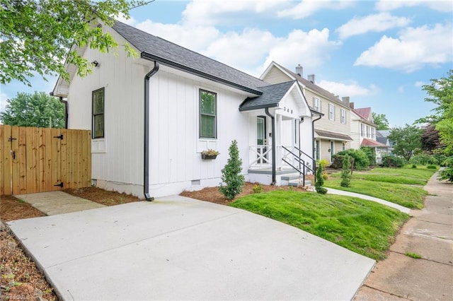 348 E Sprague St, Winston-Salem, NC 27127 - view of front of property with crawl space, roof with shingles, and a gate