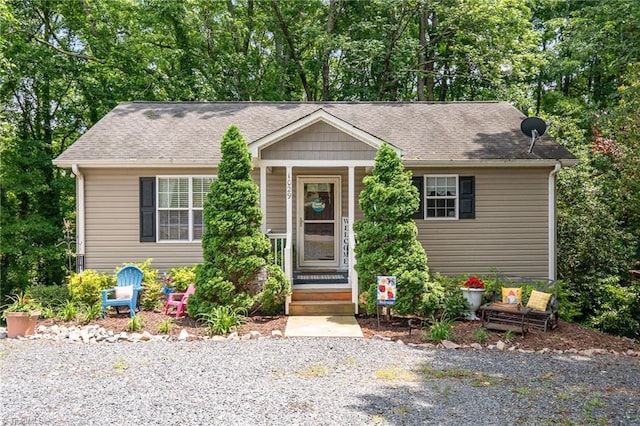 1029 Robbins St, Asheboro, NC 27203 - bungalow-style house featuring covered porch, roof with shingles, and view of scattered trees