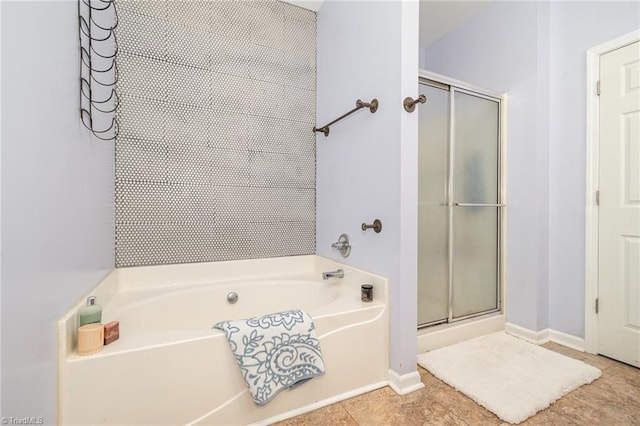1029 Robbins St, Asheboro, NC 27203 - bathroom featuring a bath, a stall shower, and tile patterned flooring