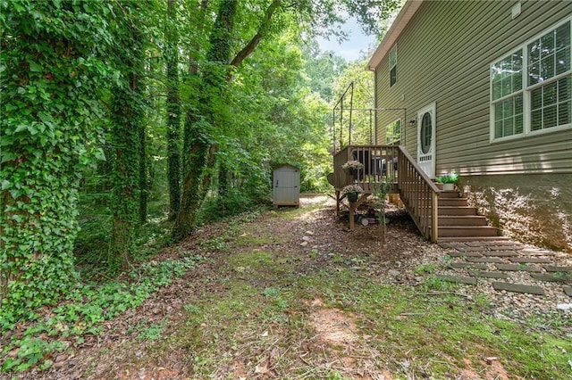 1029 Robbins St, Asheboro, NC 27203 - view of yard featuring a storage shed, stairs, and a wooden deck
