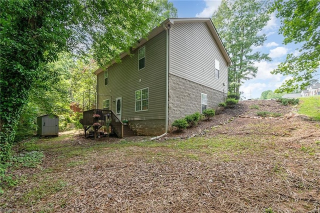 1029 Robbins St, Asheboro, NC 27203 - view of side of property featuring a shed, stairway, and a wooden deck