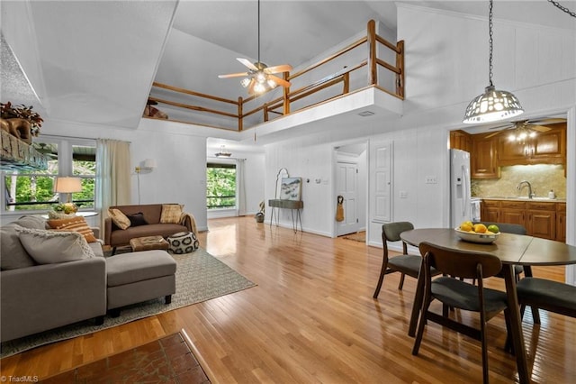 4701 Brock Dr, Hurdle Mills, NC 27541 - living area featuring ceiling fan, light wood-type flooring, and a towering ceiling