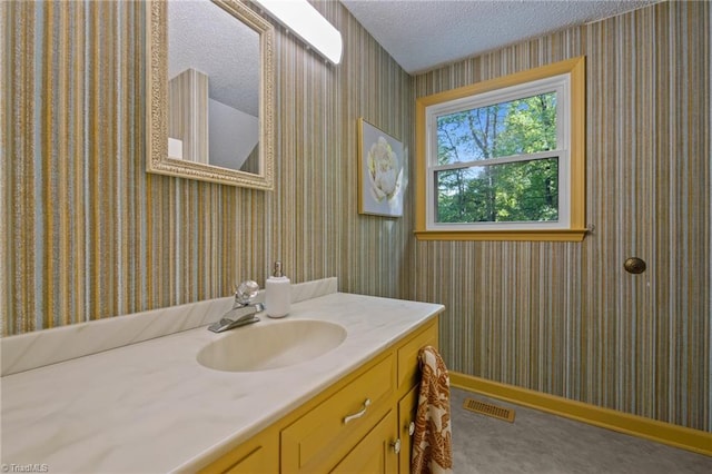 4701 Brock Dr, Hurdle Mills, NC 27541 - bathroom with wallpapered walls, vanity, a textured ceiling, and baseboards