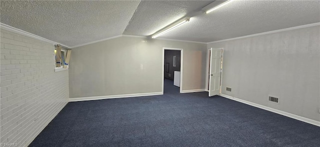 4701 Brock Dr, Hurdle Mills, NC 27541 - spare room with a textured ceiling, crown molding, baseboards, dark carpet, and brick wall