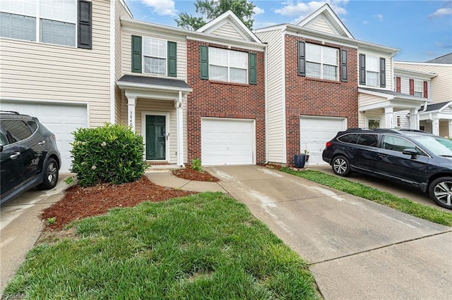 3840 Tarrant Trace Cir, High Point, NC 27265 - view of property with an attached garage, driveway, and brick siding
