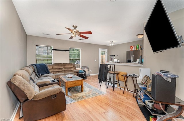 3840 Tarrant Trace Cir, High Point, NC 27265 - living area featuring healthy amount of natural light, ceiling fan, light wood-style floors, and baseboards
