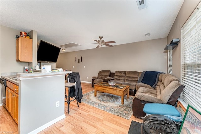 3840 Tarrant Trace Cir, High Point, NC 27265 - living room featuring light wood finished floors, ceiling fan, and baseboards