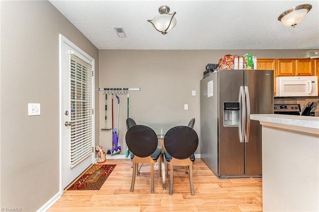 3840 Tarrant Trace Cir, High Point, NC 27265 - dining space featuring light wood-type flooring and baseboards