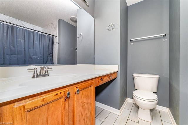 3840 Tarrant Trace Cir, High Point, NC 27265 - full bath with vanity, toilet, a textured ceiling, tile patterned flooring, and baseboards