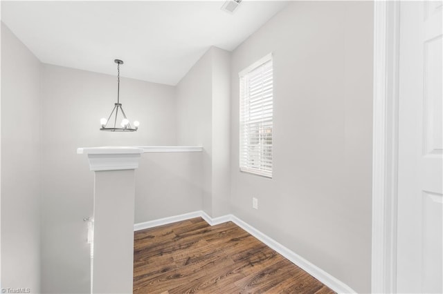 interior space with an inviting chandelier, visible vents, baseboards, and dark wood-style flooring