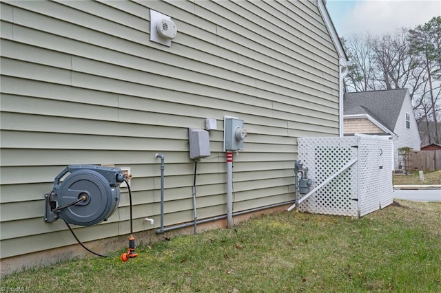 view of side of property with a lawn