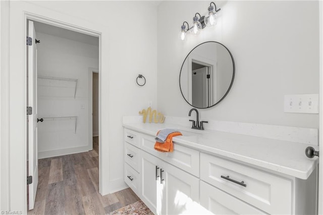 bathroom with vanity and hardwood / wood-style flooring