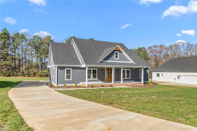 view of front of home featuring covered porch and a front lawn