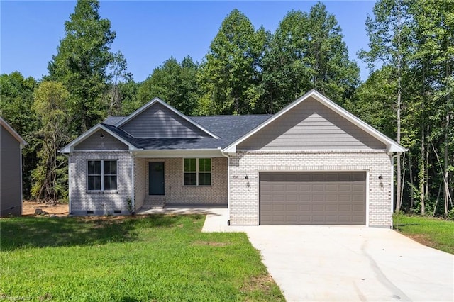 ranch-style house featuring a garage and a front yard