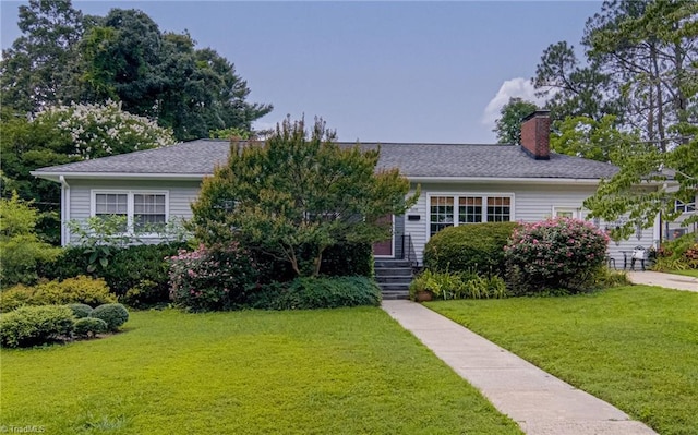509 Florham Dr, High Point, NC 27262 - view of front facade with a chimney, a front yard, and a shingled roof