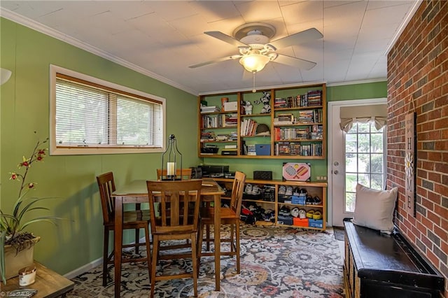 509 Florham Dr, High Point, NC 27262 - dining space featuring crown molding, ceiling fan, and brick wall