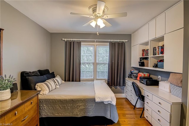 509 Florham Dr, High Point, NC 27262 - bedroom featuring light wood-type flooring, built in desk, and a ceiling fan