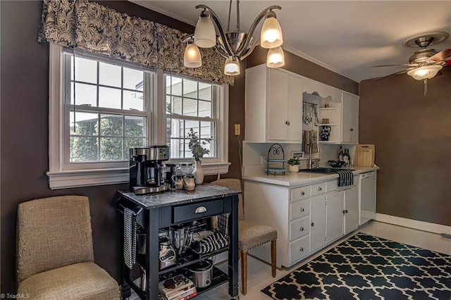 509 Florham Dr, High Point, NC 27262 - kitchen featuring dishwasher, a chandelier, light countertops, white cabinetry, and ceiling fan