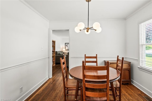 2075 Craig St, Winston-Salem, NC 27103 - dining room featuring dark wood-style floors, a chandelier, baseboards, and crown molding