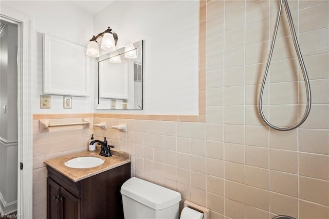 2075 Craig St, Winston-Salem, NC 27103 - bathroom with toilet, vanity, and tile walls