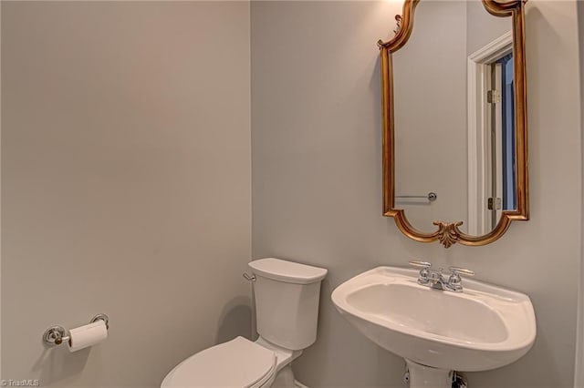 bathroom with sink and toilet