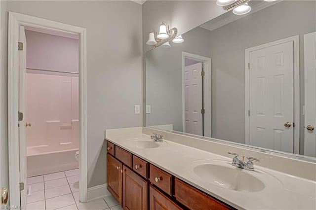 full bathroom featuring shower / tub combination, vanity, toilet, crown molding, and tile patterned flooring