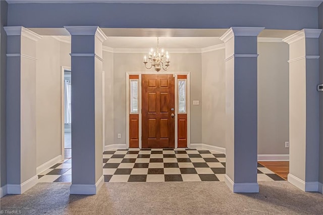 foyer with dark colored carpet, decorative columns, and ornamental molding