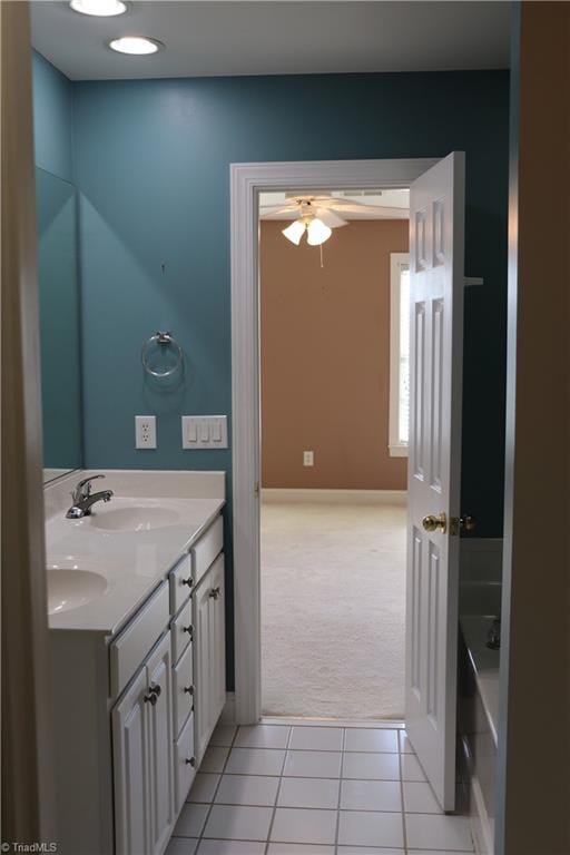 bathroom featuring vanity, tile patterned floors, and ceiling fan