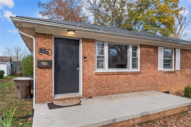 property entrance with a patio area