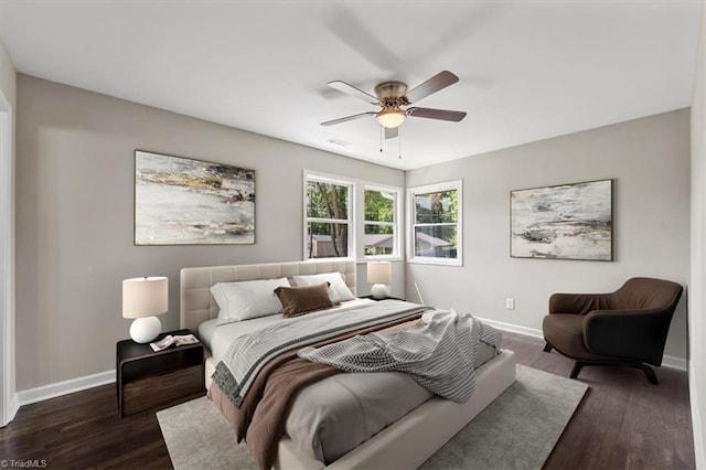 bedroom with dark wood-type flooring and ceiling fan