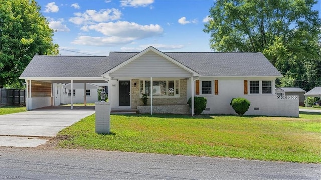 ranch-style house with a carport and a front lawn