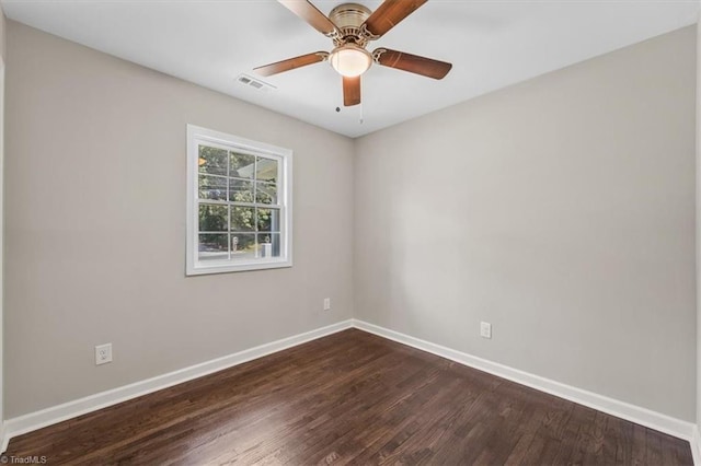 empty room with dark wood-type flooring and ceiling fan