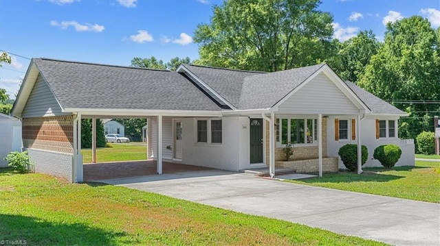 ranch-style house with a carport and a front lawn