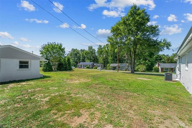 view of yard with central air condition unit